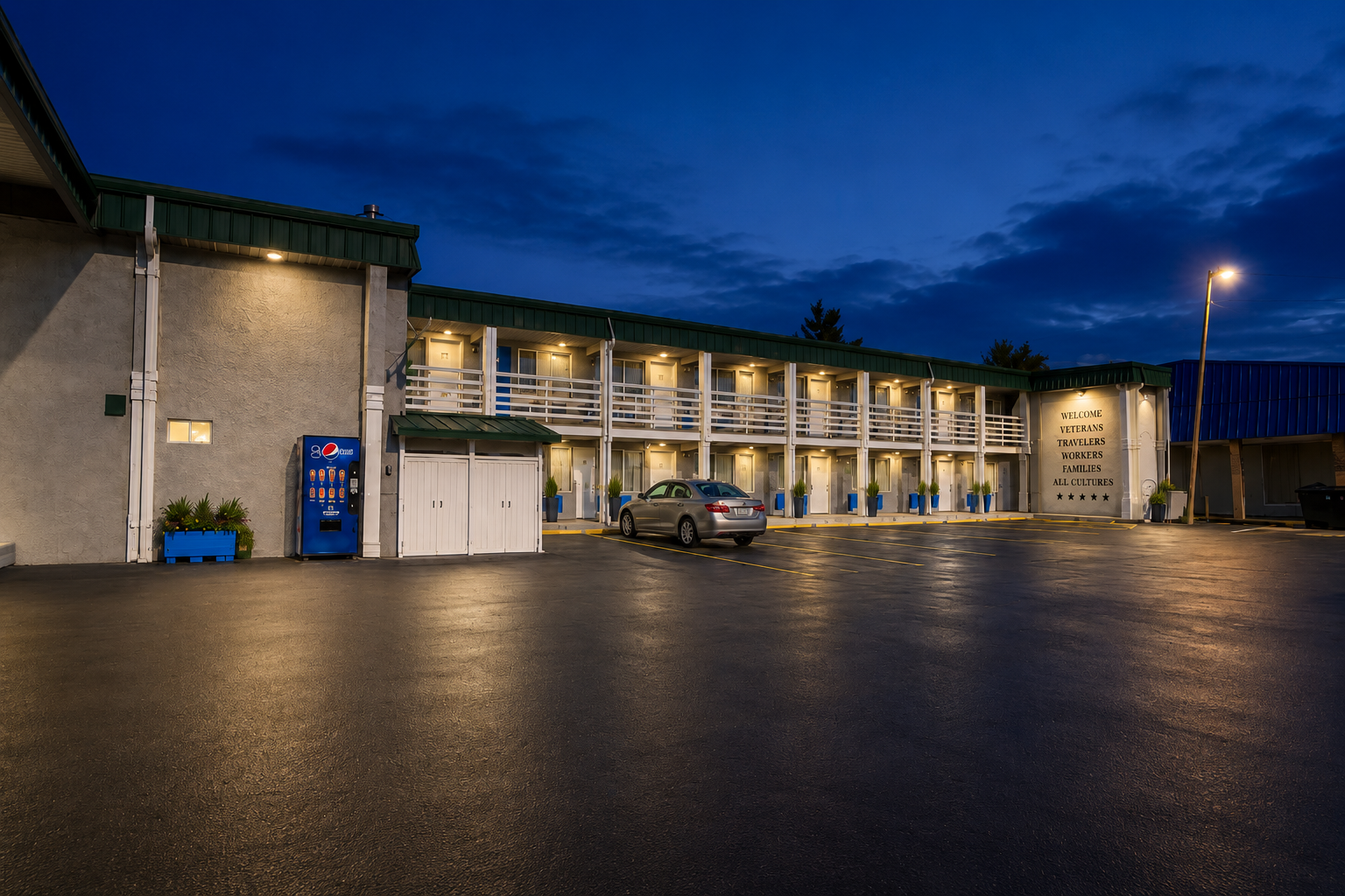 Seminole Inn parking lot at night showing the property lit up after dark